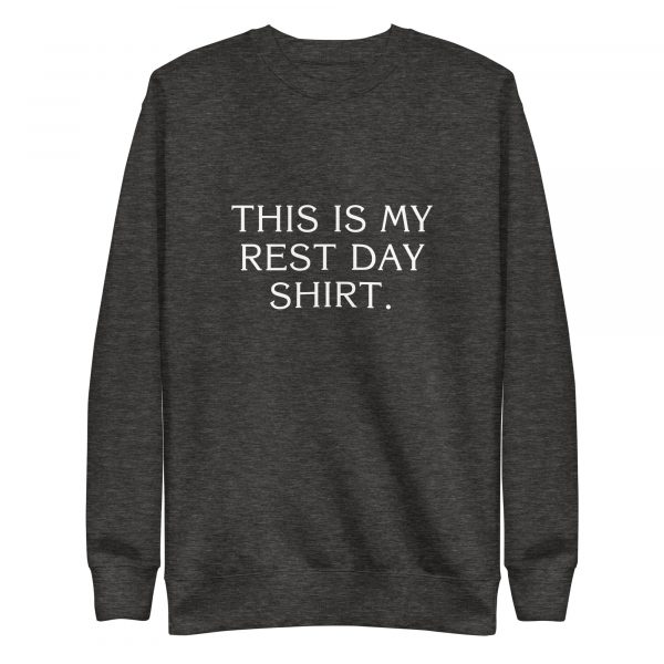 A dark gray sweatshirt with white text on the front that reads, "THIS IS MY REST DAY SHIRT." The sweatshirt has a simple crew neck design and long sleeves.